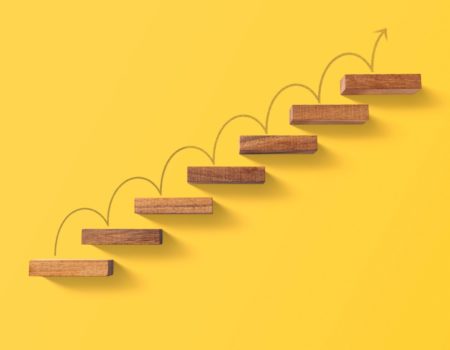 steps leading upwards on a yellow background